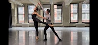 a couple of dancers in a dance studio
