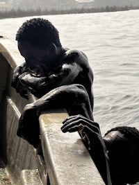 a man leaning on a railing